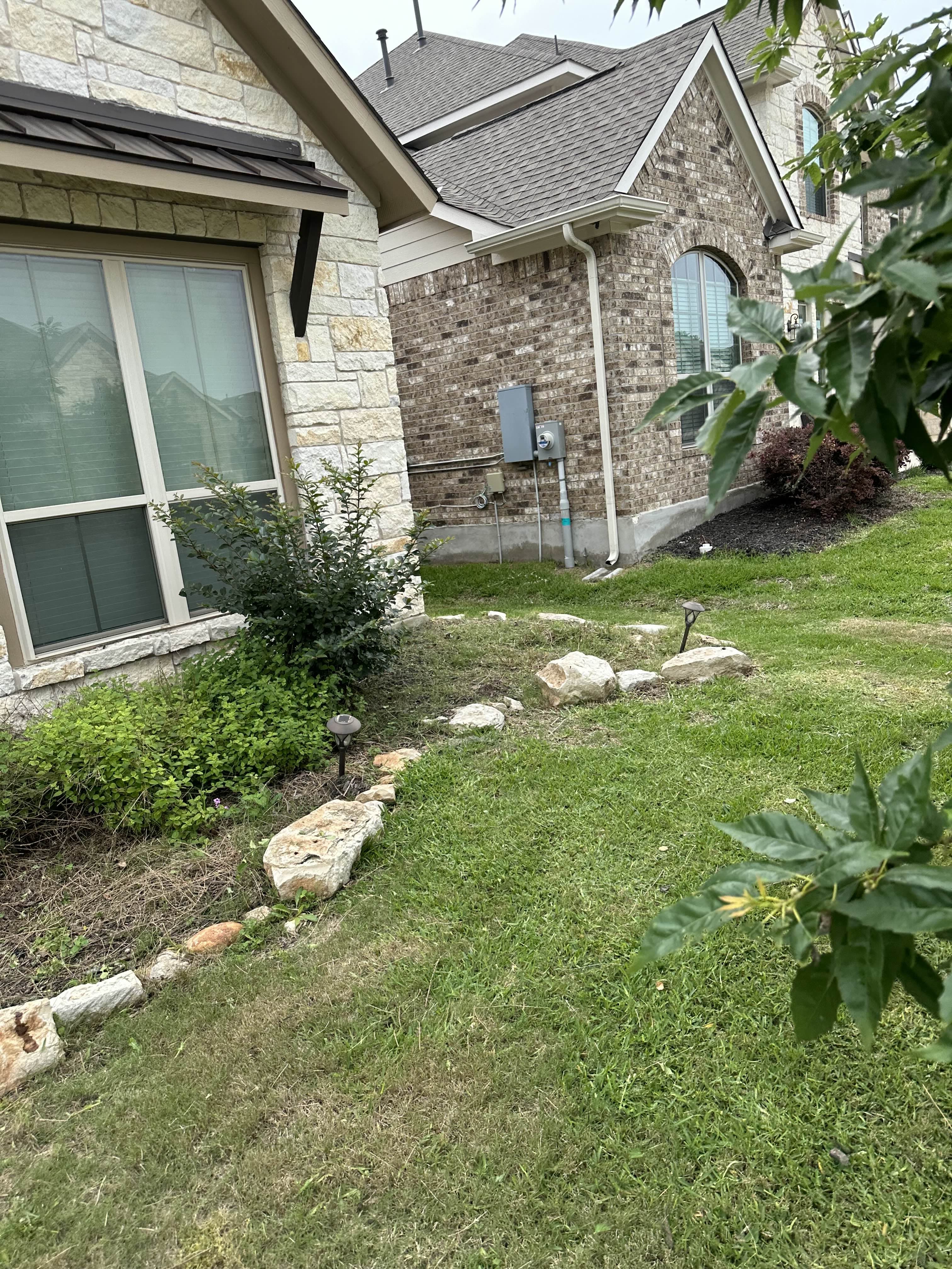 Before - A layer of black mulch adds bold contrast and a polished finish, making your plants pop and your yard look sharp and well-maintained.