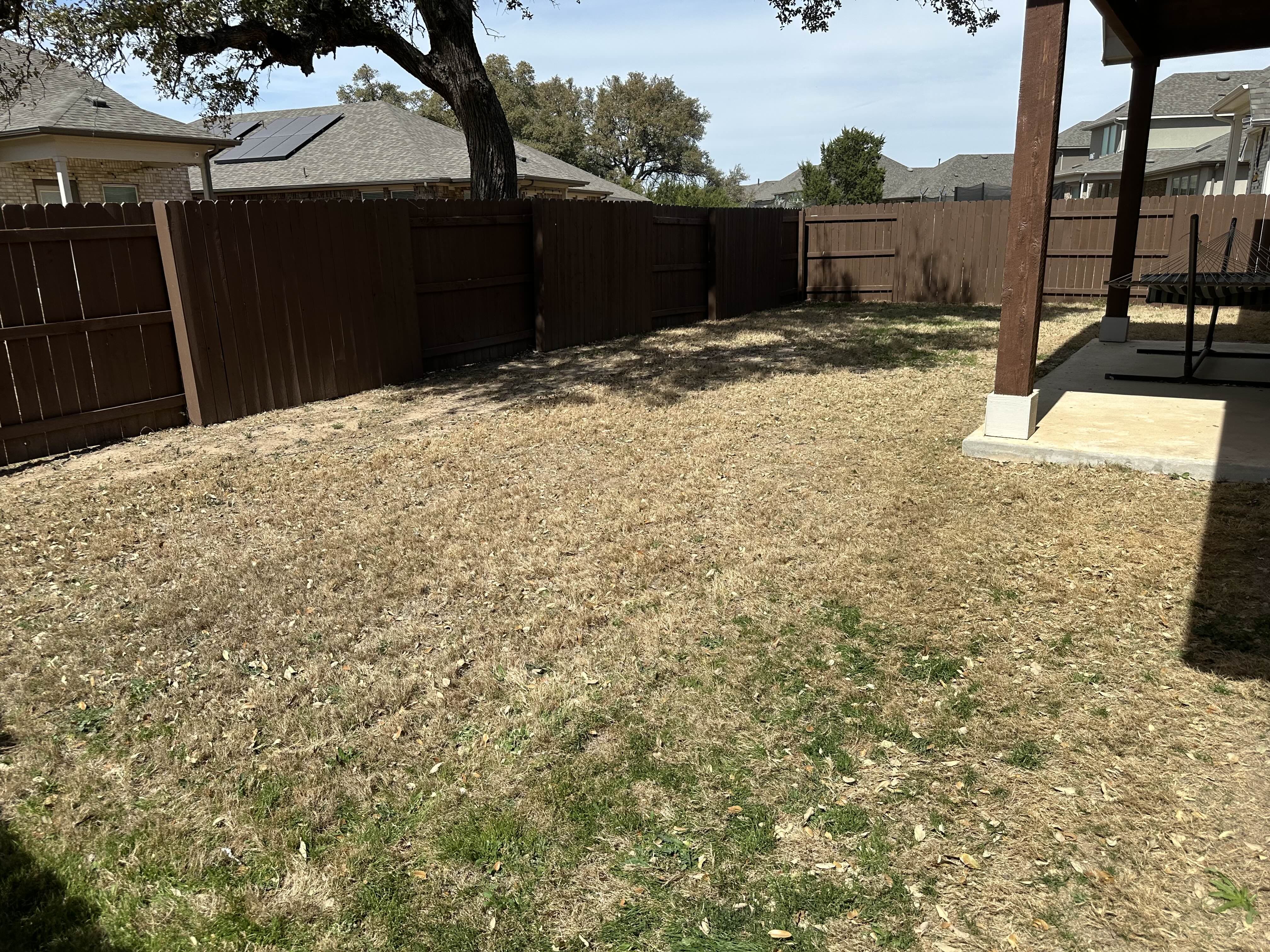 Before - This backyard was resodded to replace patchy, dying grass with fresh turf.